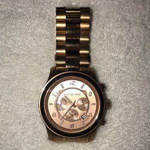 Michael Kors Rose Gold-toned women’s watch.